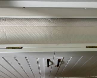 Top lifts up, lower drawer pulls out for support and doors open to unfold mattress