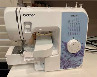 Brother XM2701 Sewing machine. 27 Unique built-in stitches: The XM2701 includes 27 built-in stitches including decorative, blind hem, zigzag, and stretch stitches and an auto-size buttonhole
Automatic needle threader and drop-in top bobbin: This sewing machine includes an automatic needle threader that perfectly pushes the thread through the needle and a convenient, jam resistant drop-in top bobbin and more great features