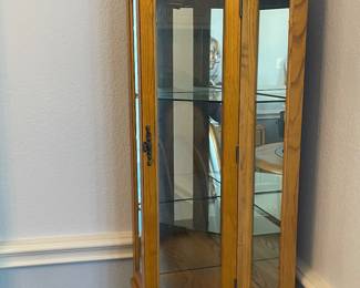 Oak and glass corner curio cabinet