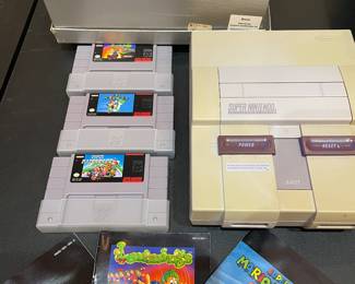 Original Super Nintendo has controllers and games like Super Mario World, Super Mario Kart 