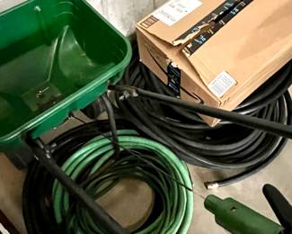 Spreader and garden hoses
