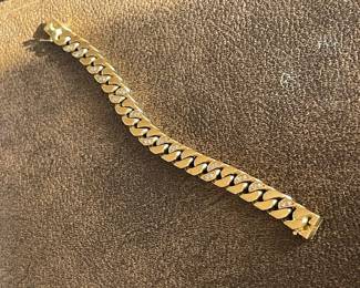 $5,900 Gold and diamond link bracelet