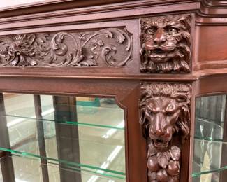 CLOSEUP VIEW CARVED LION HEADS