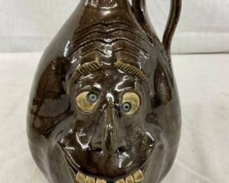 8" MELVIN CROCKER FACE JUG
