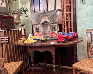 SELECTION OF ANTIQUE TOYS ON VINTAGE GATELEG TABLE