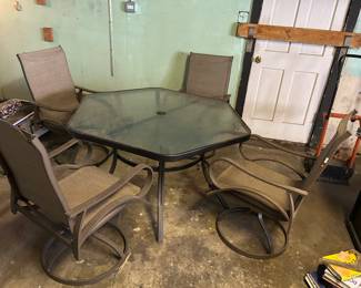 5 piece outdoor table and 4 rocker chair set, $175