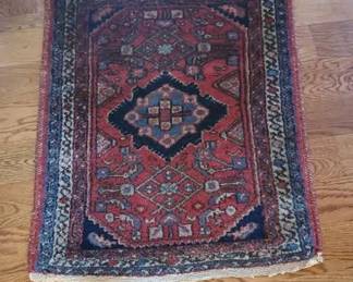 One of several oriental scatters and rugs