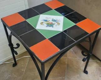 Tile and iron table with peacock scene