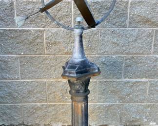 Armillary sphere sun dial on column