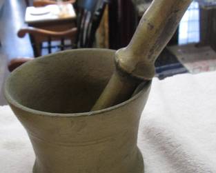Antique mortar and pestle made of brass