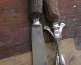 Vintage carving knife and fork set with stag horn handles.  Likely dating back to early to mid-20th century