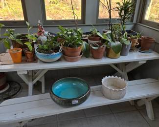 White picnic table with 2 benches. Lots of plants and pots for sale.
