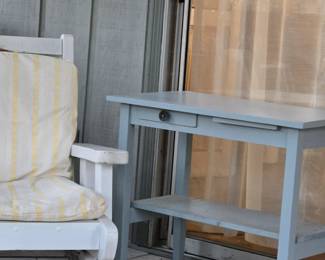 In sunroom. Chair & table.