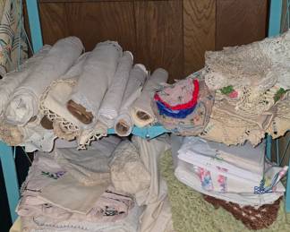 It's hard to tell but there is alot of Antique beautiful Dollies and Table Runners