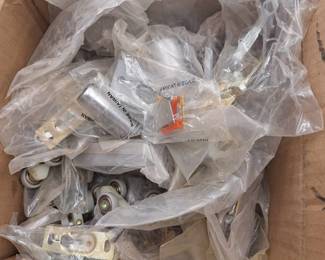 Box Of Door Stoppers And Pocket Door Roller Hardware