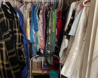 Three closets of women's clothing