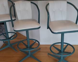 (3) creamy white/emerald padded swivel bar stools.