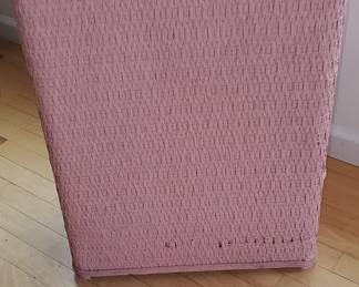 Retro 80's pink wicker hamper. It's solid, and in good condition.