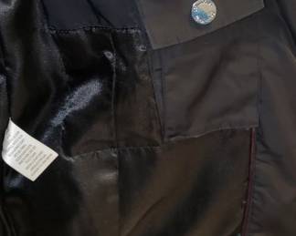 The coat has a large inside pocket along with a snap pocket for keys.