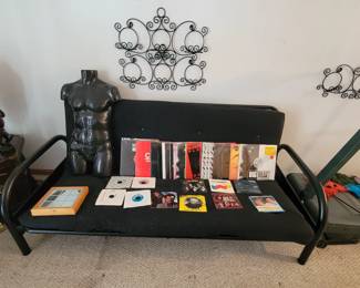 Albums and 45's, some are still sealed. Nice futon!