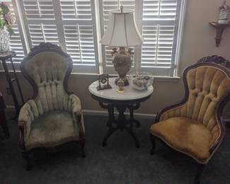 Two antique parlor chairs marble top table Victorian lamp
