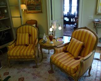 Many pairs of upholstered chairs