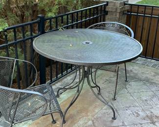wrought iron breakfast table with two wrought iron chairs