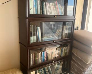 5 tier bannister/lawyer's cabinet. Measures 34"L x 11.5"W x 75"H. 