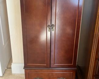 Jewelry armoire; measures 18"L x 15"W x 38"H.