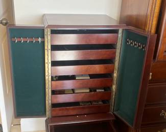 Jewelry armoire; measures 18"L x 15"W x 38"H.