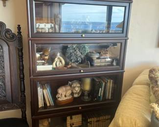 4 tier bannister/lawyer's cabinet. Measures 34"L x 11.5"W x 63"H