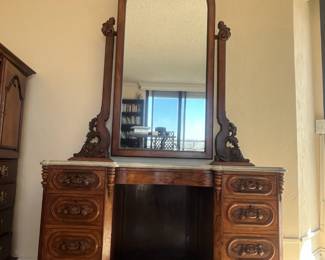 Pristine gorgeous vanity with mirror and marble top.