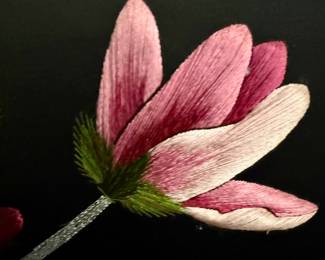 Close-up view of needlepoint art