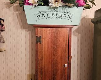 Wooden wall cabinet with shelves $30, silk plants in wooden box $20