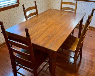 Country style table with 4 ladder back chairs