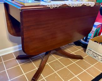 Vintage double drop leaf table with brass claw feet
