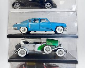 Four Displayed Die Cast Cars