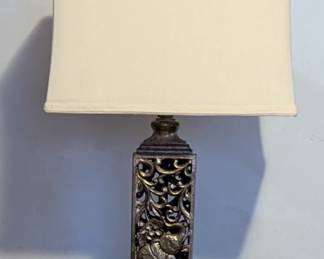 Table lamp
Donate base with floral and elephant cut out design
Shade shows normal wear due to age
29" height
Shade length is 16"