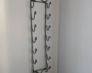 Wrought Iron Wine Rack
Holds 7 bottles
Color: Charcoal/Gray
47" length  8" width 6 3/4"depth