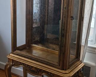 Gold Curio
Two side doors for access
Lighting
Marbled mirror back
Two glass shelves
67" height 15" depth 32 1/2" width
