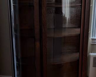 Vintage Bow Curio

Wheels for easy movement/positioning
60 3/4" height  15 1/2" depth  39" length