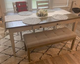 Kitchen table with two chairs and bench seat