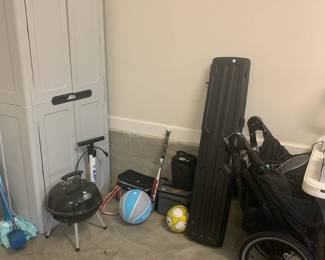 small grill, sports equipment, storage cabinet, stroller