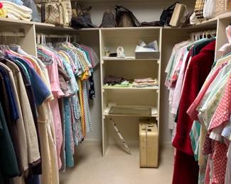 closet full of handbags, vintage dresses