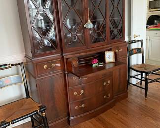 Very Large mahogany breakfront with shelves, drawers, cabinets on each side and glass front- great condition!  2 black hand painted chairs