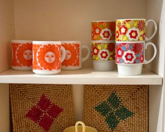 The cups on the 2 shelf are sold. The yellow pottery on the second shelf is sold.