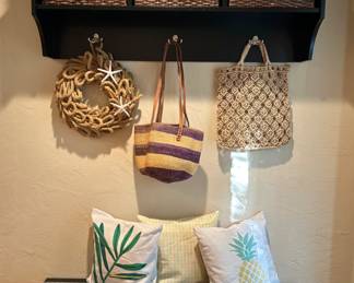 The nautical wreath and two bags that are hanging are sold.