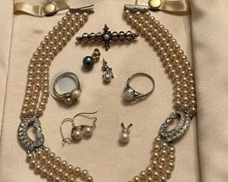 A plethora of pearls in gold and silver setting. Vintage pearl choker; pearl, diamond, and 14k gold ring; pearl and diamond pendants in while and yellow gold settings; pearl earrings; black pearl pendant in 14k gold setting