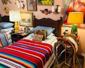 Western room designed by Ralph Lauren himself and the lovely Laura Kuykendall. Western saddle, original artwork, Mid Century Modern Lamps and decor.  