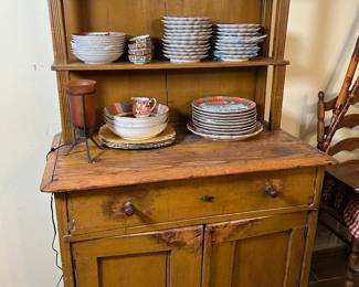 Antique hutch with beautiful Gumps china.